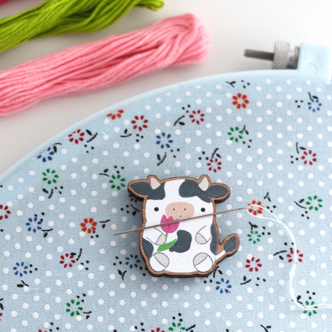 Cow Holding Tulip Wooden Needle Minder